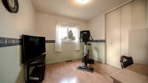5015 Marchand Crescent Ne, Calgary, AB - Indoor Photo Showing Gym Room
