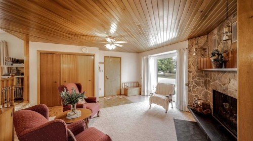5015 Marchand Crescent Ne, Calgary, AB - Indoor Photo Showing Other Room With Fireplace