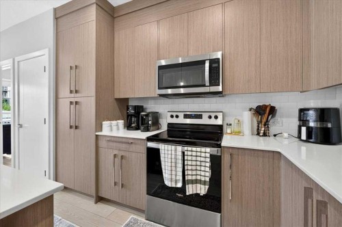 2112-681 Savanna Boulevard Ne, Calgary, AB - Indoor Photo Showing Kitchen