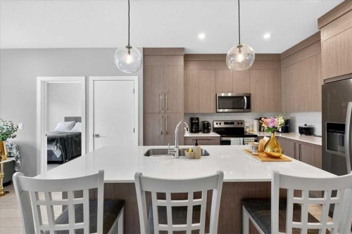 2112-681 Savanna Boulevard Ne, Calgary, AB - Indoor Photo Showing Kitchen With Double Sink With Upgraded Kitchen