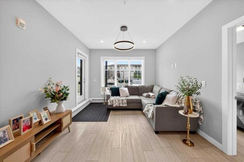 2112-681 Savanna Boulevard Ne, Calgary, AB - Indoor Photo Showing Living Room