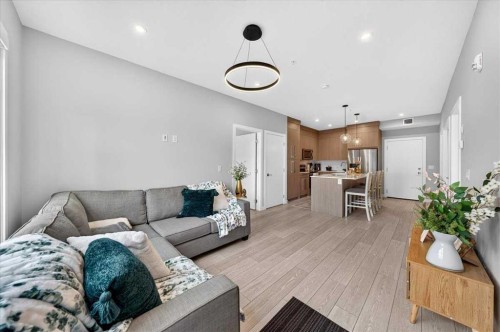 2112-681 Savanna Boulevard Ne, Calgary, AB - Indoor Photo Showing Living Room
