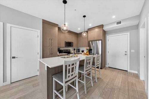 2112-681 Savanna Boulevard Ne, Calgary, AB - Indoor Photo Showing Kitchen With Upgraded Kitchen