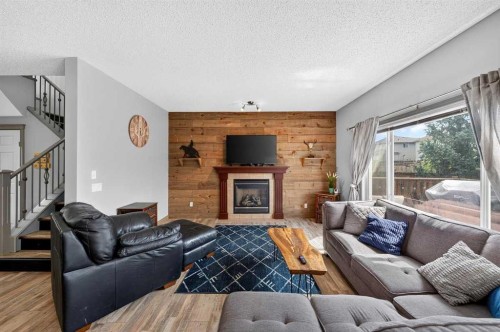 363 Evanston View Nw, Calgary, AB - Indoor Photo Showing Living Room With Fireplace