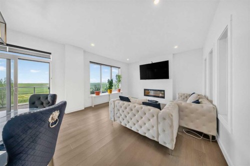 105 Homestead Crescent Ne, Calgary, AB - Indoor Photo Showing Living Room With Fireplace