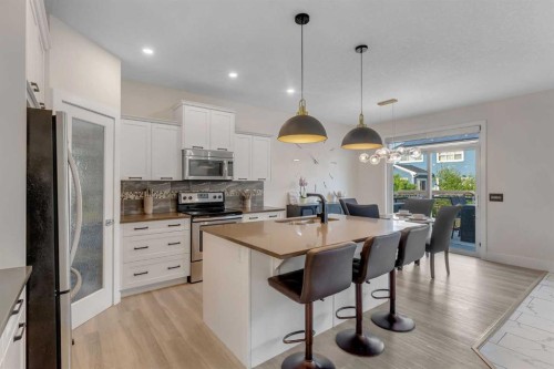 156 Rainbow Falls Heath, Chestermere, AB - Indoor Photo Showing Kitchen With Upgraded Kitchen