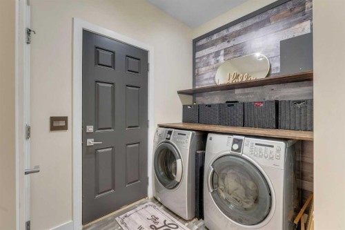 156 Rainbow Falls Heath, Chestermere, AB - Indoor Photo Showing Laundry Room