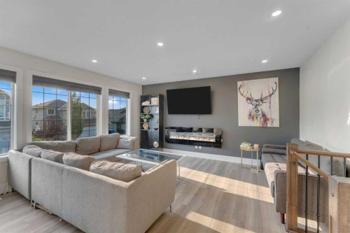 156 Rainbow Falls Heath, Chestermere, AB - Indoor Photo Showing Living Room With Fireplace