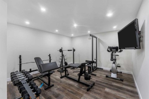 156 Rainbow Falls Heath, Chestermere, AB - Indoor Photo Showing Gym Room