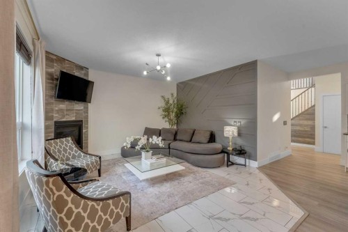 156 Rainbow Falls Heath, Chestermere, AB - Indoor Photo Showing Living Room With Fireplace