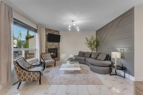 156 Rainbow Falls Heath, Chestermere, AB - Indoor Photo Showing Living Room With Fireplace