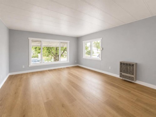 168 Huntwell Road Ne, Calgary, AB - Indoor Photo Showing Living Room