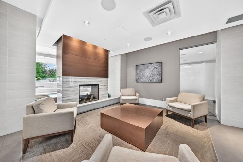 458-222 Riverfront Avenue Sw, Calgary, AB - Indoor Photo Showing Living Room With Fireplace