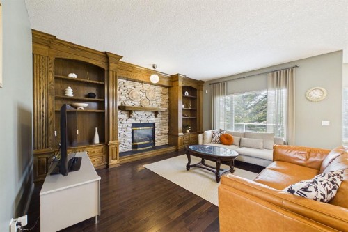 15 Royal Crest Terrace Nw, Calgary, AB - Indoor Photo Showing Living Room With Fireplace