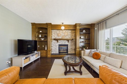 15 Royal Crest Terrace Nw, Calgary, AB - Indoor Photo Showing Living Room With Fireplace