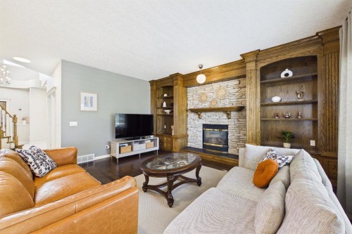15 Royal Crest Terrace Nw, Calgary, AB - Indoor Photo Showing Living Room With Fireplace
