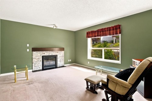 9216 Edgebrook Drive Nw, Calgary, AB - Indoor Photo Showing Living Room With Fireplace