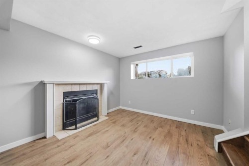 52 Erin Meadows Court Se, Calgary, AB - Indoor With Fireplace