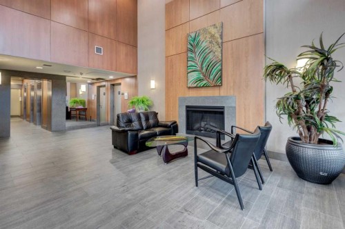 1103-77 Spruce Place Sw, Calgary, AB - Indoor With Fireplace