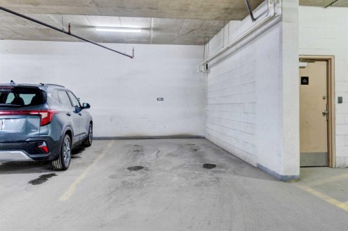 1103-77 Spruce Place Sw, Calgary, AB - Indoor Photo Showing Garage