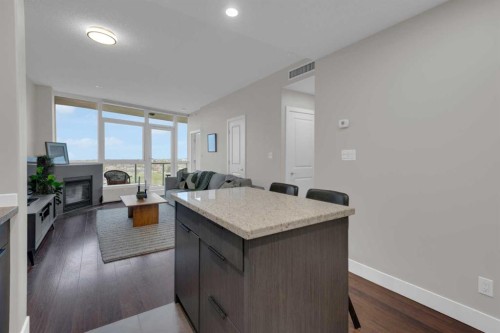 1103-77 Spruce Place Sw, Calgary, AB - Indoor With Fireplace
