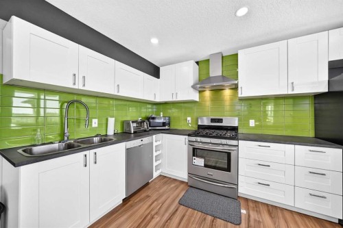 199 Hampstead Way Nw, Calgary, AB - Indoor Photo Showing Kitchen With Double Sink With Upgraded Kitchen