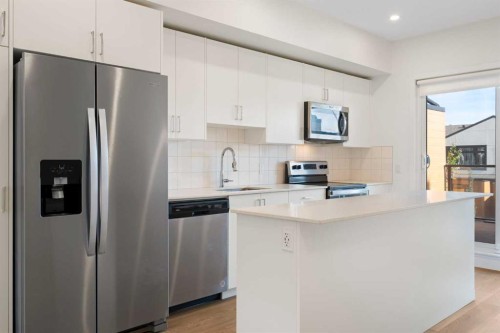 8528 21 Avenue Se, Calgary, AB - Indoor Photo Showing Kitchen With Stainless Steel Kitchen With Upgraded Kitchen