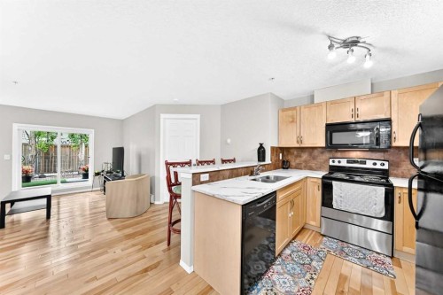 110-6315 Ranchview Drive Nw, Calgary, AB - Indoor Photo Showing Kitchen With Double Sink