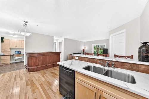 110-6315 Ranchview Drive Nw, Calgary, AB - Indoor Photo Showing Kitchen With Double Sink