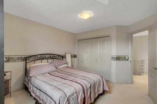 11 Tuscany Ridge Park Nw, Calgary, AB - Indoor Photo Showing Bedroom