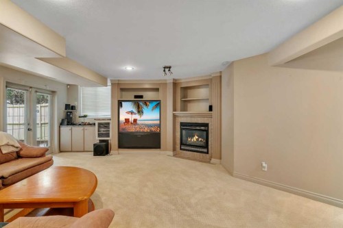 11 Tuscany Ridge Park Nw, Calgary, AB - Indoor Photo Showing Living Room With Fireplace