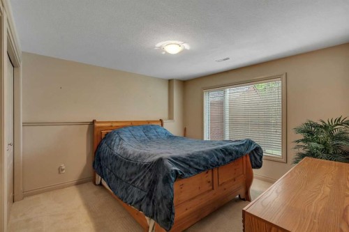 11 Tuscany Ridge Park Nw, Calgary, AB - Indoor Photo Showing Bedroom