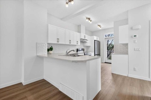 134 New Brighton Landing Se, Calgary, AB - Indoor Photo Showing Kitchen With Double Sink