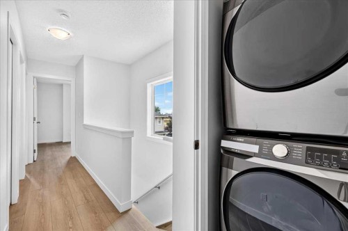 134 New Brighton Landing Se, Calgary, AB - Indoor Photo Showing Laundry Room