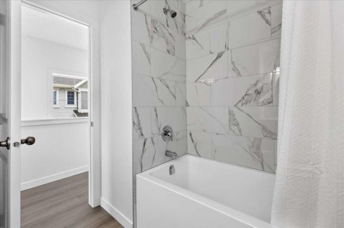 134 New Brighton Landing Se, Calgary, AB - Indoor Photo Showing Bathroom