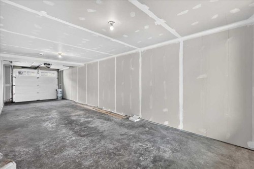134 New Brighton Landing Se, Calgary, AB - Indoor Photo Showing Garage
