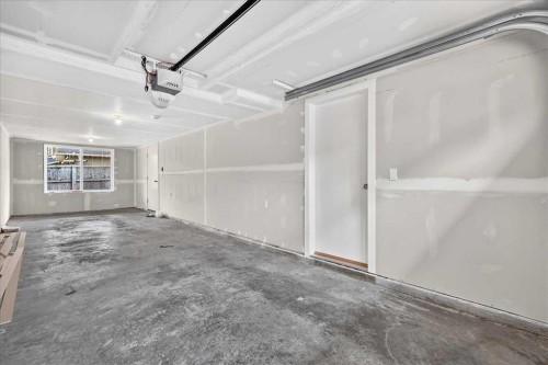 134 New Brighton Landing Se, Calgary, AB - Indoor Photo Showing Garage