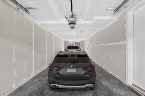 134 New Brighton Landing Se, Calgary, AB - Indoor Photo Showing Garage
