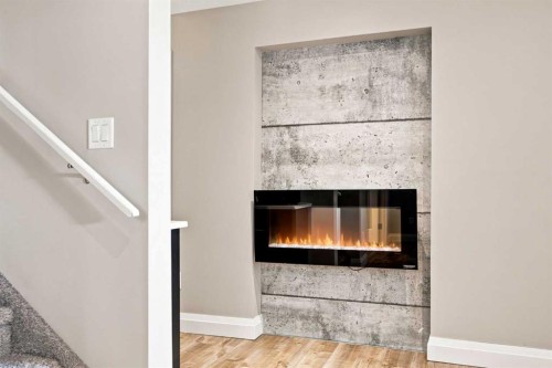 12 Masters Court Se, Calgary, AB - Indoor Photo Showing Other Room With Fireplace