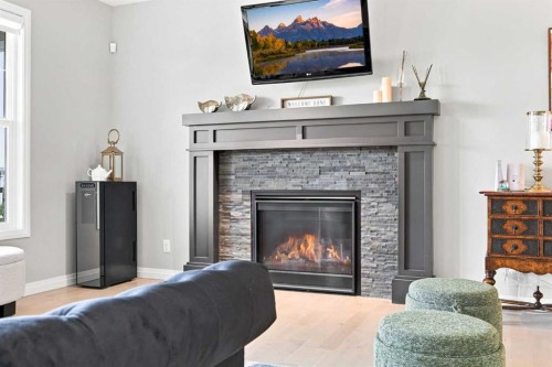 12 Masters Court Se, Calgary, AB - Indoor Photo Showing Living Room With Fireplace