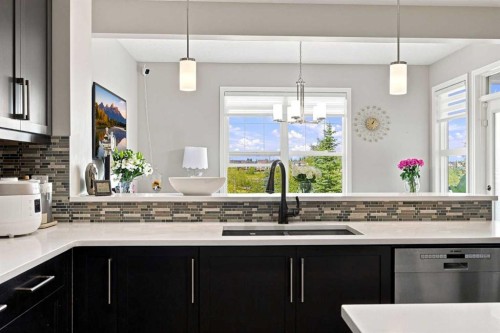 12 Masters Court Se, Calgary, AB - Indoor Photo Showing Kitchen With Double Sink With Upgraded Kitchen