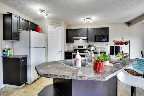 62 Covewood Manor, Calgary, AB - Indoor Photo Showing Kitchen With Double Sink With Upgraded Kitchen