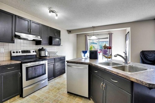 62 Covewood Manor, Calgary, AB - Indoor Photo Showing Kitchen With Double Sink