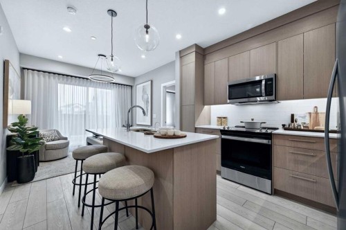 2304-265 Wolf Willow Boulevard Se, Calgary, AB - Indoor Photo Showing Kitchen With Upgraded Kitchen