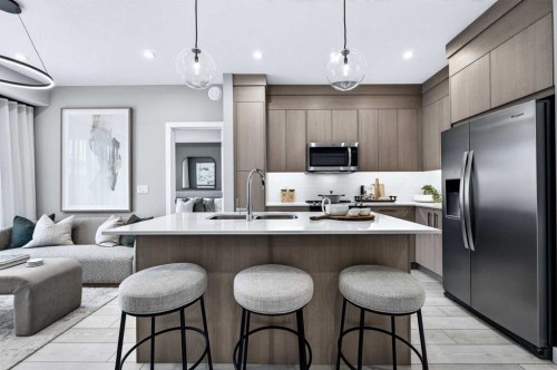 2304-265 Wolf Willow Boulevard Se, Calgary, AB - Indoor Photo Showing Kitchen With Stainless Steel Kitchen With Upgraded Kitchen