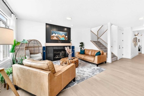 24 Emerson Crescent, Okotoks, AB - Indoor Photo Showing Living Room With Fireplace