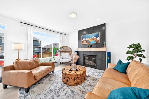 24 Emerson Crescent, Okotoks, AB - Indoor Photo Showing Living Room With Fireplace
