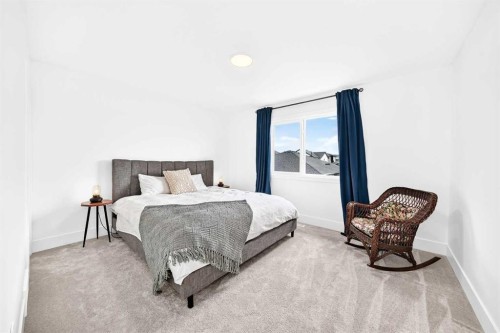 24 Emerson Crescent, Okotoks, AB - Indoor Photo Showing Bedroom