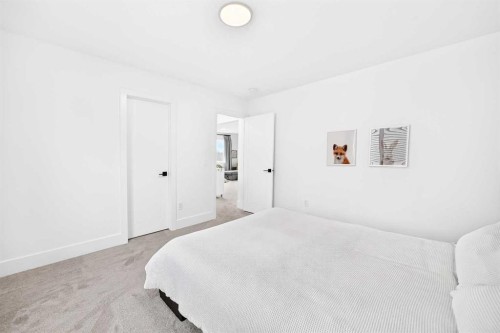 24 Emerson Crescent, Okotoks, AB - Indoor Photo Showing Bedroom