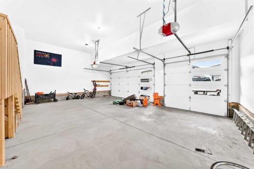 24 Emerson Crescent, Okotoks, AB - Indoor Photo Showing Garage